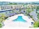 Aerial view of a unique pool surrounded by lush greenery and palm trees at 7420 Bay Island S Dr # 281, South Pasadena, FL 33707