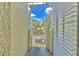 Balcony view with pillars, gate, and view of the street at 7570 Tamarind Ave, Tampa, FL 33625