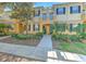 Charming two-story townhome with a landscaped front yard and inviting entryway at 7570 Tamarind Ave, Tampa, FL 33625