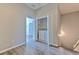Upstairs laundry room with a washer and dryer behind folding doors at 7570 Tamarind Ave, Tampa, FL 33625