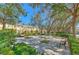 Inviting neighborhood park featuring benches, mature trees, and well-manicured landscaping at 7570 Tamarind Ave, Tampa, FL 33625