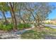 Scenic view of the neighborhood with sidewalks, green spaces, and charming homes at 7570 Tamarind Ave, Tampa, FL 33625