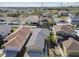 Neighborhood aerial view featuring residences, manicured lawns and mature trees at 8133 Canterbury Lake Blvd, Tampa, FL 33619