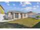 Beautiful backyard with healthy green grass, and an AC unit at 8133 Canterbury Lake Blvd, Tampa, FL 33619