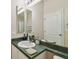 Bathroom featuring a sink, mirror, and vanity, and offering a functional space at 8133 Canterbury Lake Blvd, Tampa, FL 33619