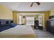 Bedroom with a large bed, bay windows, and a dresser, providing ample space and storage at 8133 Canterbury Lake Blvd, Tampa, FL 33619