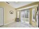 Dining area with tile floors and sliding glass doors leading to the yard at 8133 Canterbury Lake Blvd, Tampa, FL 33619