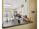 Kitchen view with a breakfast bar overlooking the sink and modern appliances at 8133 Canterbury Lake Blvd, Tampa, FL 33619