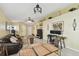 Open-concept living room featuring a brown leather sofa, a ceiling fan, and light yellow walls at 8133 Canterbury Lake Blvd, Tampa, FL 33619