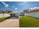 Expansive backyard includes a carport and seating area, perfect for outdoor relaxation and entertainment at 921 57Th N Ave, St Petersburg, FL 33703