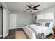 Comfortable bedroom with neutral tones, stylish bedding, and natural light at 921 57Th N Ave, St Petersburg, FL 33703