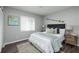 Cozy bedroom with modern decor, neutral walls, and plush bedding at 921 57Th N Ave, St Petersburg, FL 33703
