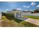Spacious driveway and carport surrounded by lush greenery at 921 57Th N Ave, St Petersburg, FL 33703