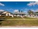 Inviting single-story home with lush green lawn and tidy landscaping creates a welcoming exterior at 921 57Th N Ave, St Petersburg, FL 33703