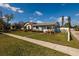 Single-story home with a well-kept lawn and inviting curb appeal showcases neighborhood charm at 921 57Th N Ave, St Petersburg, FL 33703