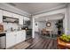 Open concept kitchen with stainless steel appliances and an adjacent dining area featuring stylish flooring at 921 57Th N Ave, St Petersburg, FL 33703
