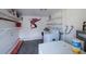 Clean laundry area with washer, dryer, and organized shelving for storage at 921 57Th N Ave, St Petersburg, FL 33703