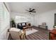 Bright and airy living room with hardwood floors, brick wall, and comfortable seating at 921 57Th N Ave, St Petersburg, FL 33703