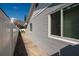 Exterior side view of the property featuring siding, windows, and a walkway at 921 57Th N Ave, St Petersburg, FL 33703