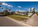 Charming neighborhood street showcases well-maintained homes with landscaped yards on a sunny day at 921 57Th N Ave, St Petersburg, FL 33703