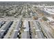 An aerial view of the mobile home park with many homes close together, trees and ponds at 10116 Tulip N St # 10116, Pinellas Park, FL 33782