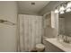 Bathroom with a shower-tub combo, white tiled walls, and vanity with a mirror at 10116 Tulip N St # 10116, Pinellas Park, FL 33782