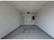 Spacious carport featuring a concrete floor and access door at 10116 Tulip N St # 10116, Pinellas Park, FL 33782