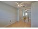 Bright dining room with ceiling fan, wood floors, wainscoting, and open to the living room at 10116 Tulip N St # 10116, Pinellas Park, FL 33782