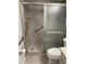 Updated bathroom featuring a tiled shower with grab bars at 11200 102Nd Ave # 125, Seminole, FL 33778