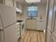 Functional kitchen with white appliances and laminate countertops at 11200 102Nd Ave # 125, Seminole, FL 33778