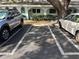 Assigned parking spot in front of building with mature landscaping at 11200 102Nd Ave # 125, Seminole, FL 33778