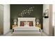 Cozy bedroom features a bed, stylish decor, tasteful butterflies artwork, and neutral light at 11542 E 71St Ter, Palmetto, FL 34221