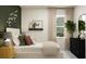 Well-lit bedroom with bed, butterfly accents, neutral colors, and tasteful decor at 11542 E 71St Ter, Palmetto, FL 34221