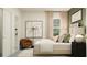 Comfortable bedroom featuring a bed, modern decor, neutral colors, and natural light at 11542 E 71St Ter, Palmetto, FL 34221