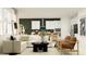 Open-concept living area with a sofa, kitchen, and stylish decor at 11542 E 71St Ter, Palmetto, FL 34221