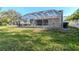 Spacious backyard with a screened-in pool, perfect for outdoor enjoyment and relaxation at 12545 Leatherleaf Dr, Tampa, FL 33626