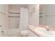 Clean bathroom with a shower-tub combo, tile flooring, and a vanity with a sink at 12545 Leatherleaf Dr, Tampa, FL 33626