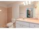The neutral bathroom offers a walk-in shower, a toilet, and a white vanity with a sink at 12545 Leatherleaf Dr, Tampa, FL 33626