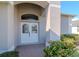 Close-up of a welcoming front entrance with a double door and brick-paved walkway at 12545 Leatherleaf Dr, Tampa, FL 33626