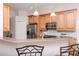 Well-equipped kitchen with stainless steel appliances, granite countertops, and ample cabinet space at 12545 Leatherleaf Dr, Tampa, FL 33626