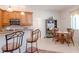 Bright kitchen features wooden cabinets, modern appliances and a breakfast bar with seating at 12545 Leatherleaf Dr, Tampa, FL 33626