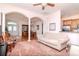 Spacious living room with archways, hardwood floors, and a view into the kitchen at 12545 Leatherleaf Dr, Tampa, FL 33626