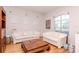 Comfortable living room featuring plush sofas, natural light, and stylish decor at 12545 Leatherleaf Dr, Tampa, FL 33626