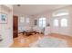 Bright and airy living room with hardwood floors, large windows, and elegant furniture at 12545 Leatherleaf Dr, Tampa, FL 33626