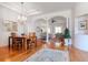 Open-concept living space with dining area, hardwood floors, and an inviting ambiance at 12545 Leatherleaf Dr, Tampa, FL 33626