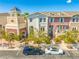 Aerial view of neighborhood with several styles of townhomes, cars parked on the street, and palm trees at 12557 Bassbrook Ln, Tampa, FL 33626