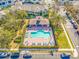 Overhead shot of the community pool highlighting ample seating, privacy landscaping, and accessibility at 12557 Bassbrook Ln, Tampa, FL 33626