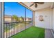 Relaxing screened-in patio features a decorative fountain and artificial grass at 12557 Bassbrook Ln, Tampa, FL 33626