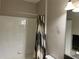 Bathroom featuring a white tub with white tiles and a decorative shower curtain at 13359 Orca Sound Dr, Riverview, FL 33579