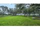 Lush community park provides relaxing green space with mature trees and walking trails at 13359 Orca Sound Dr, Riverview, FL 33579